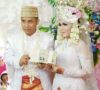 Pernikahan Andre dan Feni Berlangsung Meriah