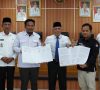 Pemkab, KPU dan Bawaslu OKI Tandatangani NPHD Pemilu
